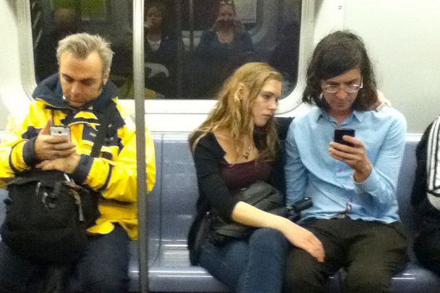 These people are not actually using their cell service on the L...but soon enough!
